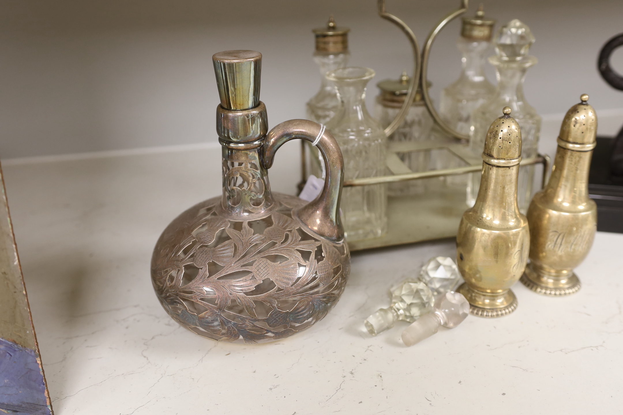 A pair of Tiffany silver peppers, a plated cruet and an overlaid whisky decanter, Tiffany peppers 14.5cm high